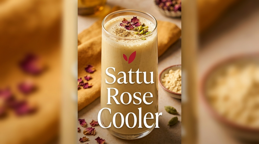 Sattu Rose Cooler - a creamy Indian sattu drink with rose water and cardamom, garnished with rose petals and pistachios