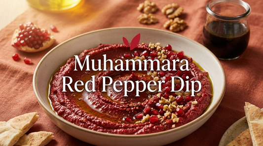 Muhammara - a Syrian roasted red pepper and walnut dip garnished with pomegranate seeds, olive oil, and Aleppo pepper