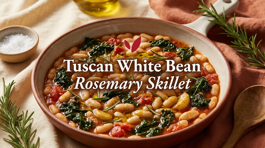 Tuscan White Bean and Rosemary Skillet - creamy cannellini beans with wilted kale, tomato, rosemary and garlic in a glossy olive oil sauce in a rustic ceramic bowl