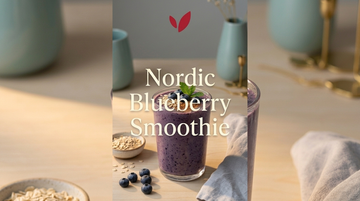 Nordic Blueberry Oat Smoothie - creamy vegan blueberry oatmeal smoothie in a glass on a Scandinavian table